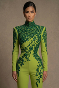 Front close-up of the lime green couture jumpsuit with emerald crystal neckline and botanical detailing